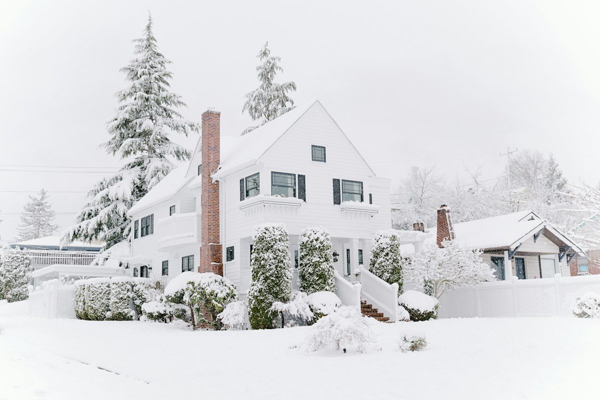 Snow-covered Toledo-area home needing air sealing and weatherization