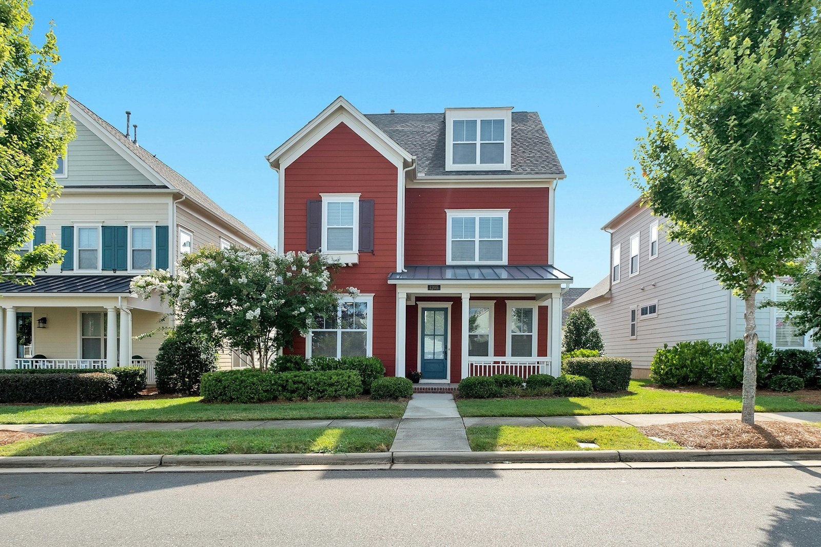 Bright, well-maintained two-story home exterior on a sunny day in Toledo, OH